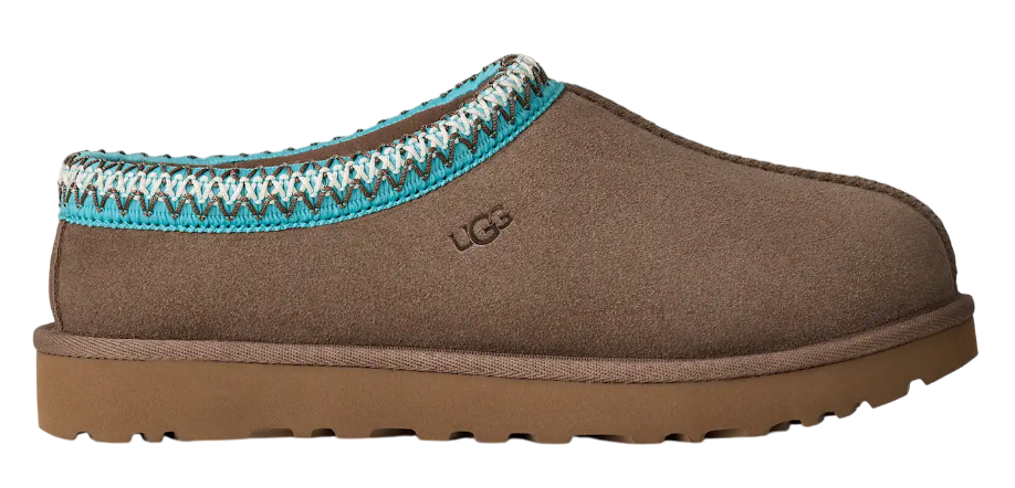 Brown UGG slipper with decorative trim on a white background
