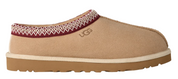 Tan UGG slipper with a white sole on a white background