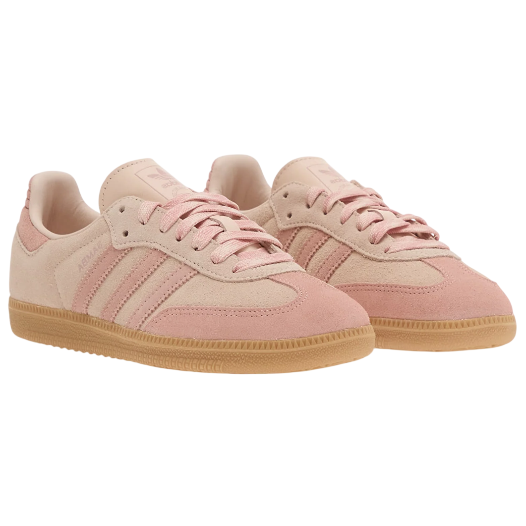 Pair of pink Adidas sneakers on a white background
