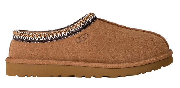 Brown slipper with decorative trim on a white background