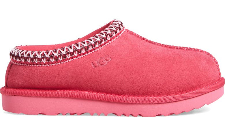 Pink slipper with decorative trim on a white background