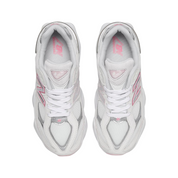 White sneakers with pink accents on a white background