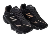 Pair of black athletic shoes with brand logo on a white background