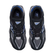 Pair of black and gray running shoes with blue accents on a white background