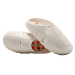 White baby shoes with Nike logo on a white background - Image 2