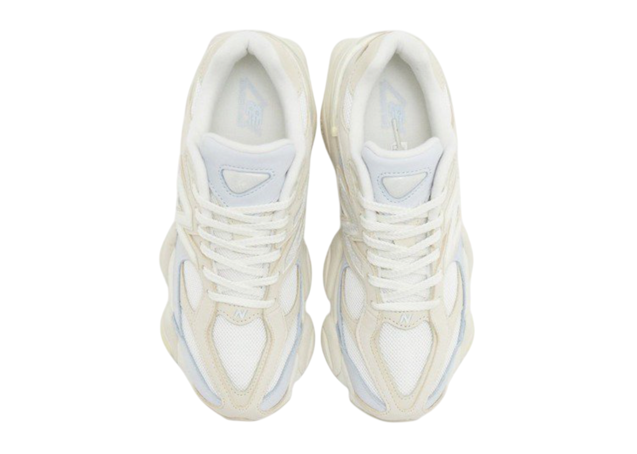 Pair of white sneakers on a white background
