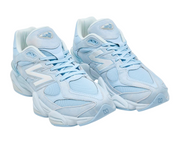 Light blue sneakers with white accents on a white background