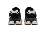Black and pink sneakers with a unique sole design on a white background