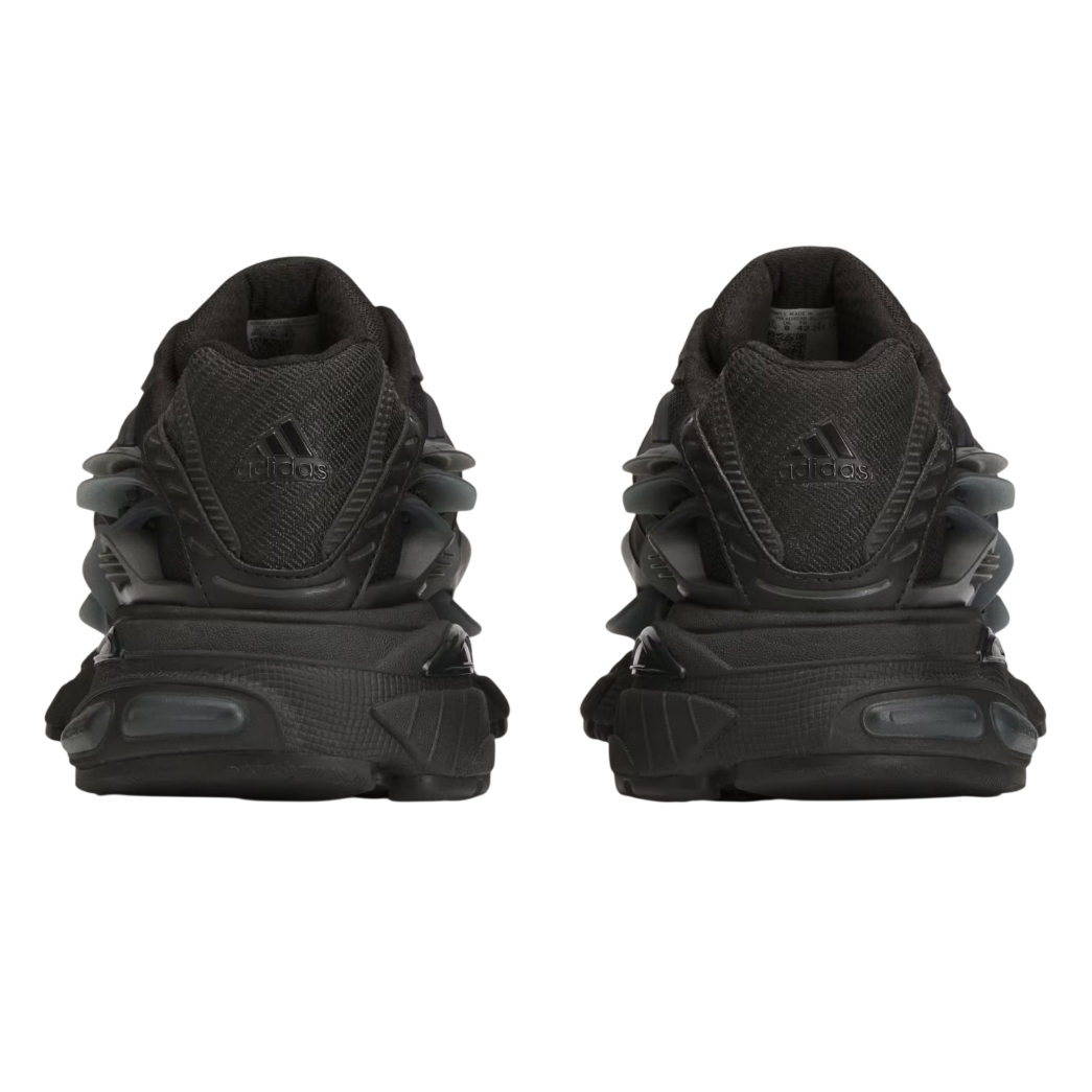 Black Adidas sneakers shown from the back on a white background