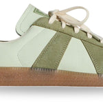 Green and white sneaker with brown sole on a white background — detail - Image 5