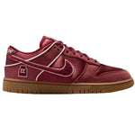 Red sneaker with a brown sole on a white background - Image 1