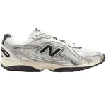 White New Balance sneaker with black logo on a white background - Image 1