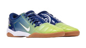 Pair of blue and green sports shoes on a white background