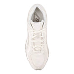 White sneaker with New Balance logo on a light gray background - Image 3