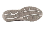Close-up of a gray shoe sole with New Balance branding on a white background - Image 5