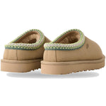 Pair of tan slippers with green trim on a white background - Image 8